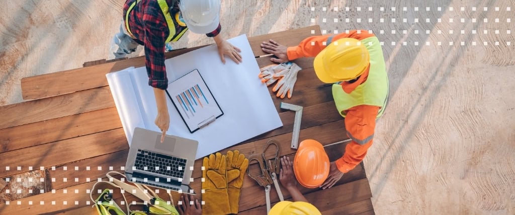 Contractor and owner reviewing GMP