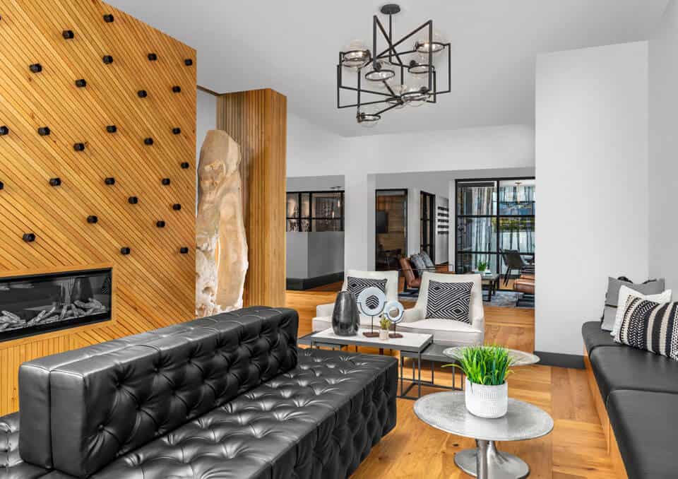 Elegant living room featuring contemporary furniture, wooden accents, and ample sunlight for a welco.