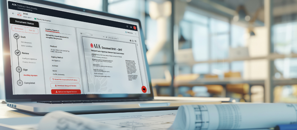 AIA Contract Document B101-2017: The Standard Form of Agreement Between Owner and Architect on a laptop in an architect's office