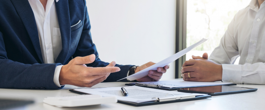 A GC and his insurer hold a meeting to finalize policies