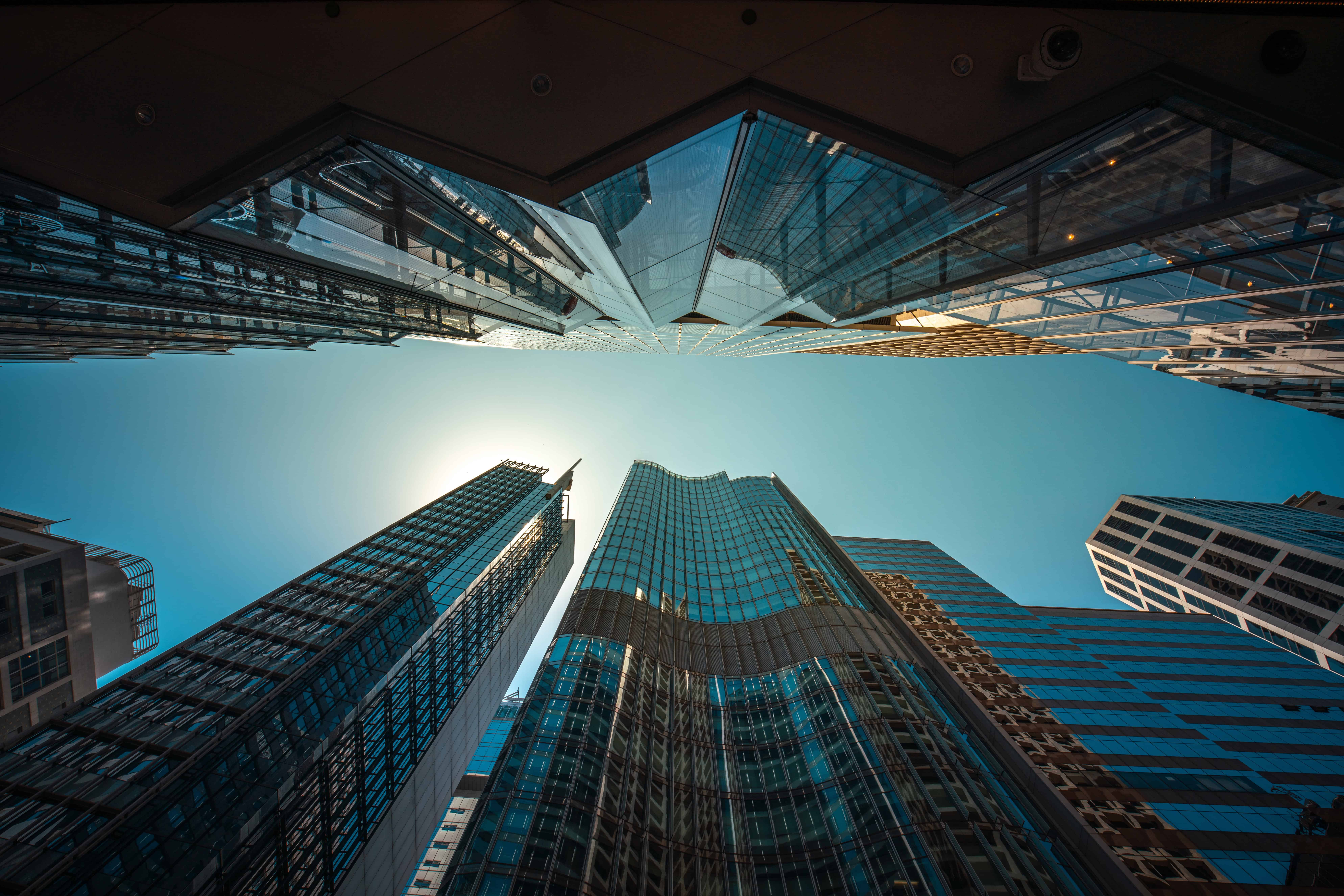 Modern skyscrapers in a financial district skyline.
