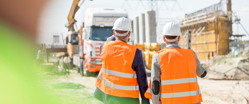 Construction team collaborating under an Integrated Project Delivery (IPD) contract